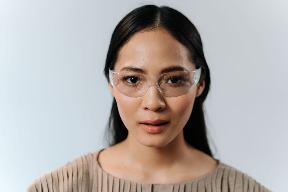 A woman wearing clear protective glasses
